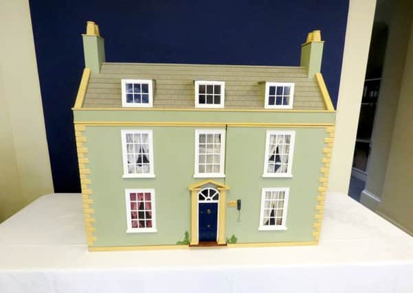 An estate agents is treating the dolls house as a proper home for sale on Rightmove to raise money for a nursing home. Photo: SWNS NNL-170408-115337001