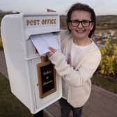 Matilda Handy, 9, and mum, Leanne Handy 45 with their letter box to heaven, in Gedling Crematorium, which allows grieving members of the public to write a letter to their loved ones who have passed away.  (Picture credit by SWNS)