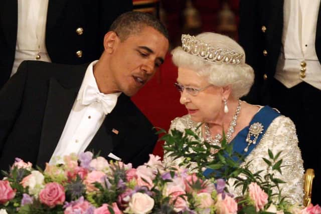 President Barack Obama shares a private conversation with Queen Elizabeth II during a State Banquet in Buckingham Palace in 2011 (photo: Getty Images)