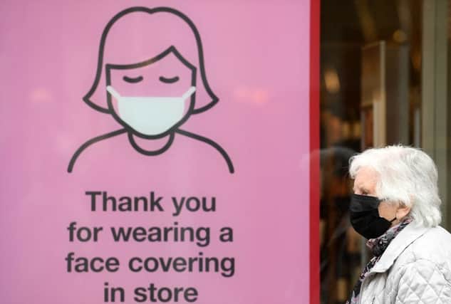Rules on face masks are to be extended in an attempt to stop tougher Christmas restrictions (Photo: OLI SCARFF/AFP via Getty Images)