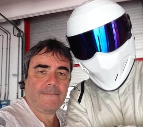 Top Gear director Brian Klein pictured here with the show’s iconic racing driver, The Stig.