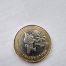 The £2 coin features the official mascot of the games, Tosha the Cat, as well as the logo of the games.