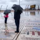 Holidaymakers brave the rain on Blackpool promenade on August 14.