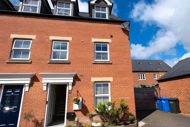 The Sage Close property combines a three-storey layout with off-road parking and a detached garage
