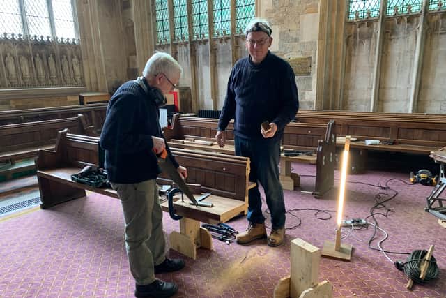Bob and David shorten the old pews