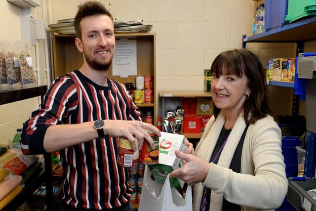 Staff Connor Southwood and Deb Parker at the BYHP foodbank NNL-191012-175954009