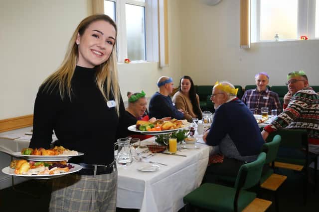 Plates are served at the Bloxham Christmas Day lunch