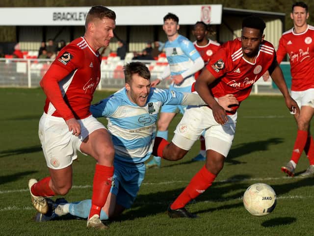 Brackley Town skipper Gaz Dean and Thierry Audel snuff out the danger against Farsley Celtic. Photo: Jake McNulty