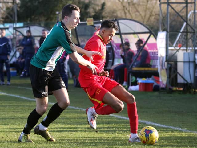 Banbury United's Amer Awadfh holds the ball up against Bromsgrove Sporting. Photo: Steve Prouse
