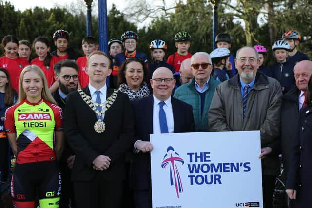 Pro-cyclist, Katie Scott (left) joined by Bicester mayor, Jason Slaymaker; councillor Ian Hudspeth, leader of OCC; councillor Barry Wood, leader of CDC and councillor Richard Mould as well as Bicester school children