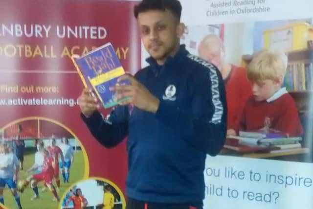 Banbury Utd midfielder Amer Awadh with a much loved Roald Dahl book