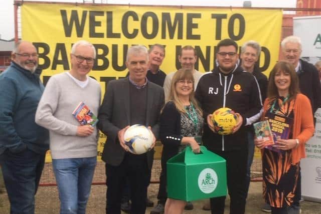 ARCH volunteers with Banbury Utd Chairman Phil Line (holding the ball). Elaine Adams, left, and Jane Rendle are managers of the charity