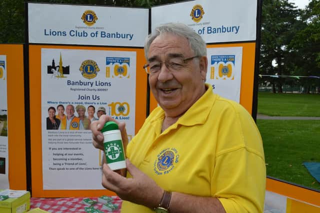 Graham Raven, president of Banbury Lions, holds a message in a bottle  a scheme promoted by the Lions that makes a persons essential medical information easily available if emergency services are called to an illness or accident at home.