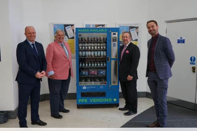 A PPE vending machine with the Rt Hon Sir Tony Baldry, Westminster Security Group CEO Peter Fowler, the group's General Manager Hamish Russell, and Oliver Wren, the shopping centre's manager.