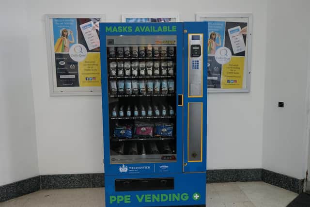 Personal protective equipment (PPE) such as face masks can be purchased at vending machines like this one at Castle Quay Shoppping Centre