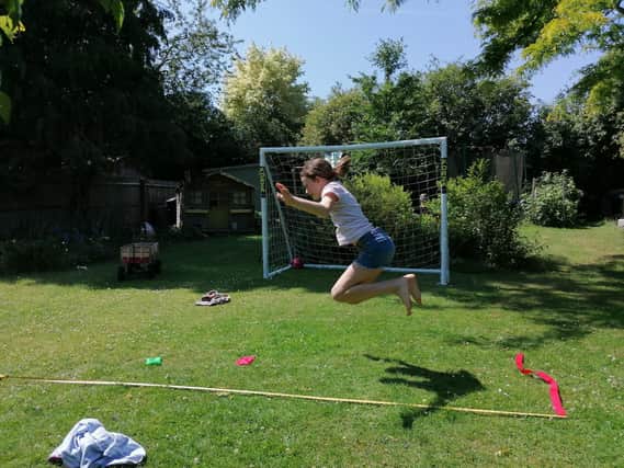 Freya Brown takes part in the school's sporting activities from her garden.