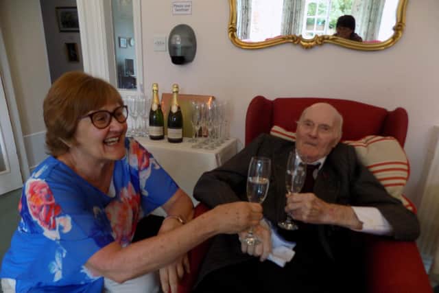 John Campion (known as Capper to his friends and family,) enjoys a celebratory drink with Dr Paula du Rand, the manager of the Kineton Manor Nursing Home.