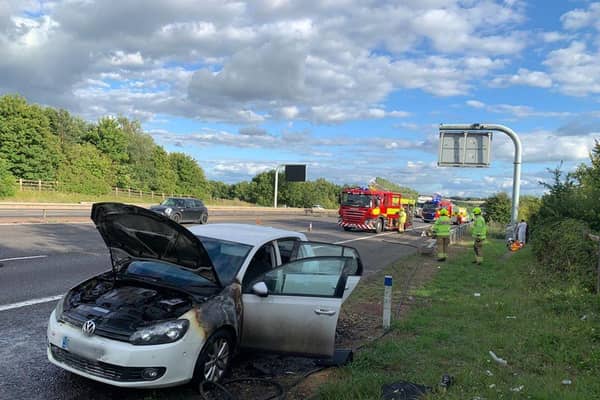 Firefighters with three crews, including Oxfordshire Fire and Rescue Service respond to a car fire on the M40 near Banbury