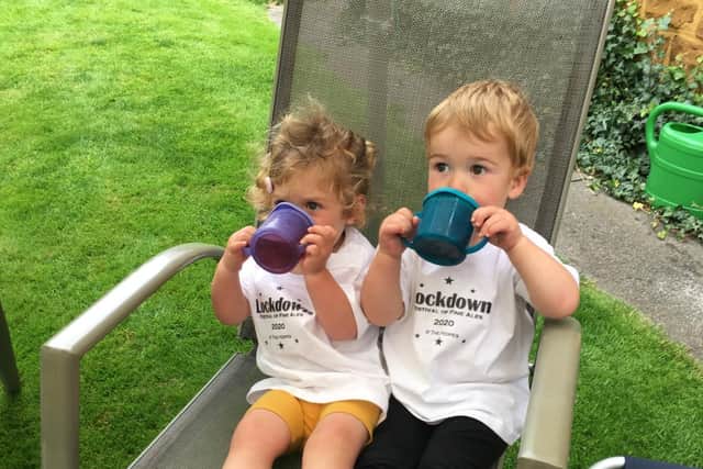 Imogen Hope and Finn Nixon enjoy their non-alcoholic liquid refreshment at their grandfather Kevin Hope's Father's Day Festival of Ales