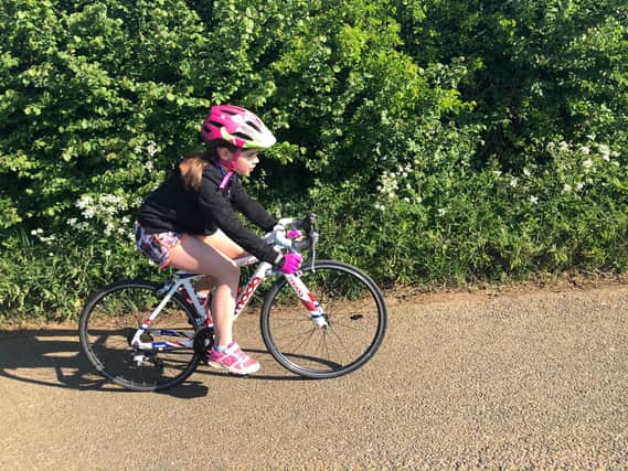 Jorgie Gillett, an 8-year-old pupil from Middleton Cheney Primary School, has cycled more than 230 miles during lockdown to benefit the charity, Dementia Oxfordshire.