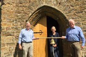 Andrew and Nicola McHugh, right, and church warden of St Annes Epwell, Alasdair Lowe with the bell