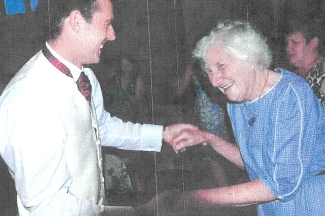 Alison in 2014 dancing with grandson-in-law, Ben