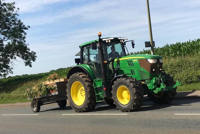 The decorated tractor and trailer funeral cortege travels from Duns Tew to Banbury