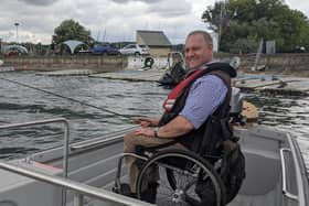 Andy Beadsley, director of The Wheelyboat Trust, using the new C16 Wheelyboat (Photo from Thames Water)