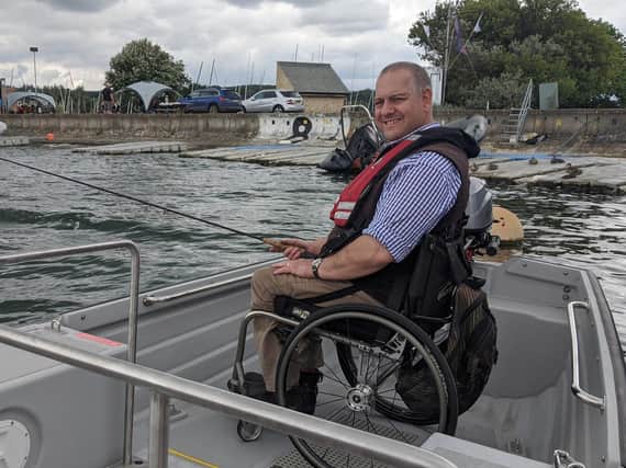 Andy Beadsley, director of The Wheelyboat Trust, using the new C16 Wheelyboat (Photo from Thames Water)