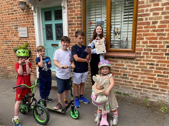 Several children take part in the Kineton Treasure Hunt - pictured: Kaitlynn, William Brayden and Ginny Harris and William and Zachary Clement