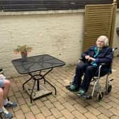 A resident and her grandson at Featherton House