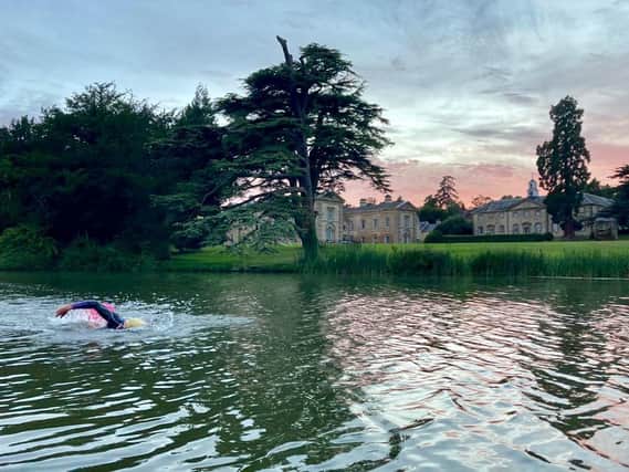 Corinne Moss, who is a coach with Do3 Coaching andthe current double British Triathlon Champion, swims at open water swimming venue at Compton Verney near Kineton (photo by David Knight, owner and head coach at Do3 Coaching)