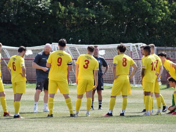 Manager Andy Whing talks to his Banbury United players during their 3-2 friendly success at Easington Sports last weekend. Pictures by Julie Hawkins