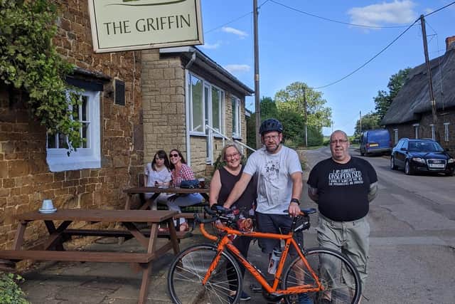 David Kelly is pictured outside The Griffin with landlords Sally and Andy. In the background are Penny and Lorraine Kelly