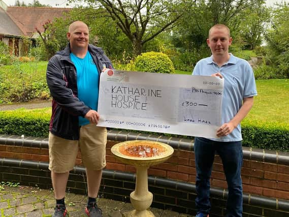 David Feeley and James Radbourn with a big cheque for Katharine House Hospice