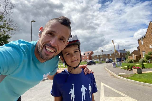 Richard and his son Noah, aged 8, who joins him on his bike on training runs.