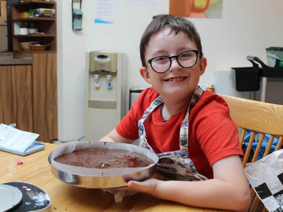 Nathan Best, aged 8, from Banbury, cooking chocolate cake
