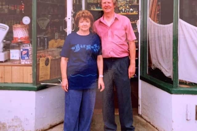 Peter and Joan Buzzard outside their shop several years ago