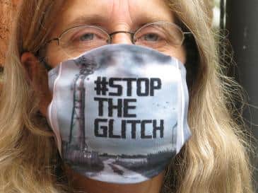 Shipston author and retired educator, Chris Malone, wears her #Stoptheglitch face mask
