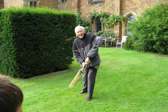 A 2006 snapshot of Lord Saye and Sele playing cricket with one of his grandsons