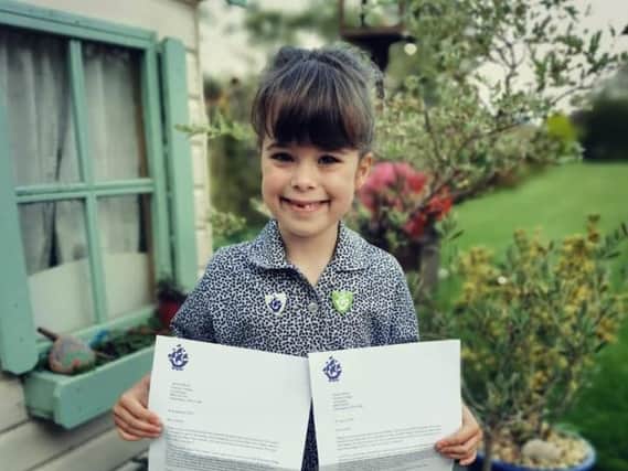 Amelia Berrie, a year one pupil at Winchester House School in Brackley, recently received two Blue Peter badges