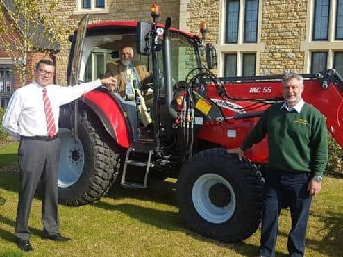 The town of Brackley now has a new tractor. Pictured: Mr Adrian Winnitt, managing director of Mccomick, the town Mayor Cllr Chris Cartmell, and Mr Mark Stopwin of M-Trac Ltd. (photo from Brackley Town Council)