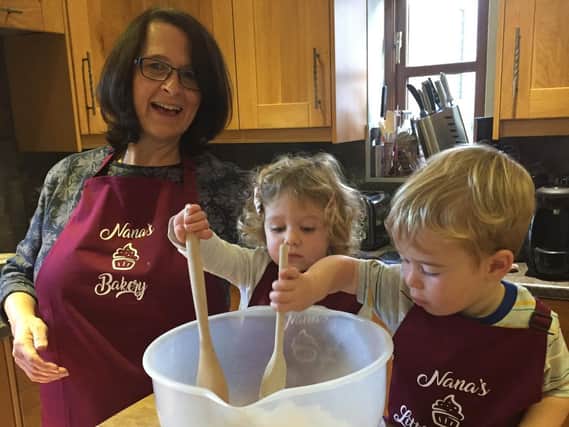 Hazel Hope at home baking with grandchildren Imogen and Finn