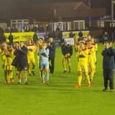 The Banbury United players applaud the travelling supporters after their fine win at Nuneaton Borough on Tuesday night. Picture by Dave Shadbolt