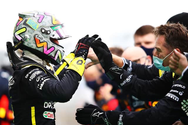 Daniel Ricciardo celebrates his first podium for Renault