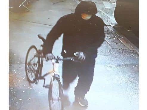 CCTV image released by police of man wanted for questioning in connection to newsagents robbery in Bicester