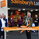 Cllr John Colegrave - Banbury Town Mayor - cuts the ribbon to announce the new Sainsbury store open