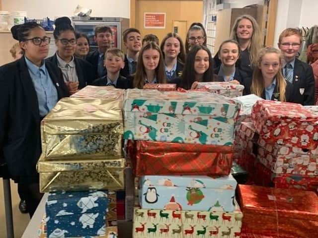 Students from North Oxfordshire Academy with teacher Alexandra Wilkinson who packed 77 shoeboxes last year