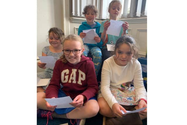 Carrdus School pupils with the residents' letters in answer to theirs (photo from Care UK’s Highmarket House)