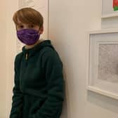 Isaac Finlay with his lockdown picture in the exhibition at the Ashmolean Museum